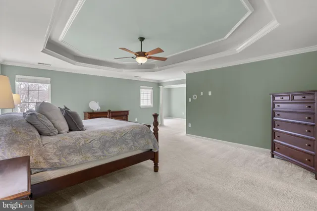 a en suite bathroom with a double vanity sink and a mirror
