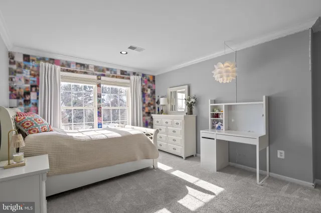 a view of an empty room with a cabinet and a window