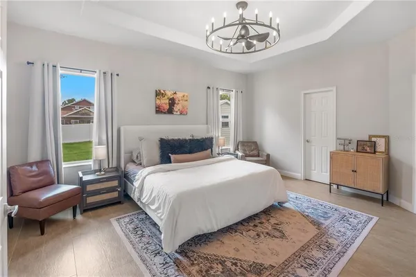 a bedroom with a large bed and a couch