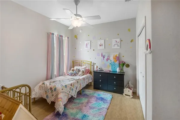 a bedroom with furniture and a chandelier