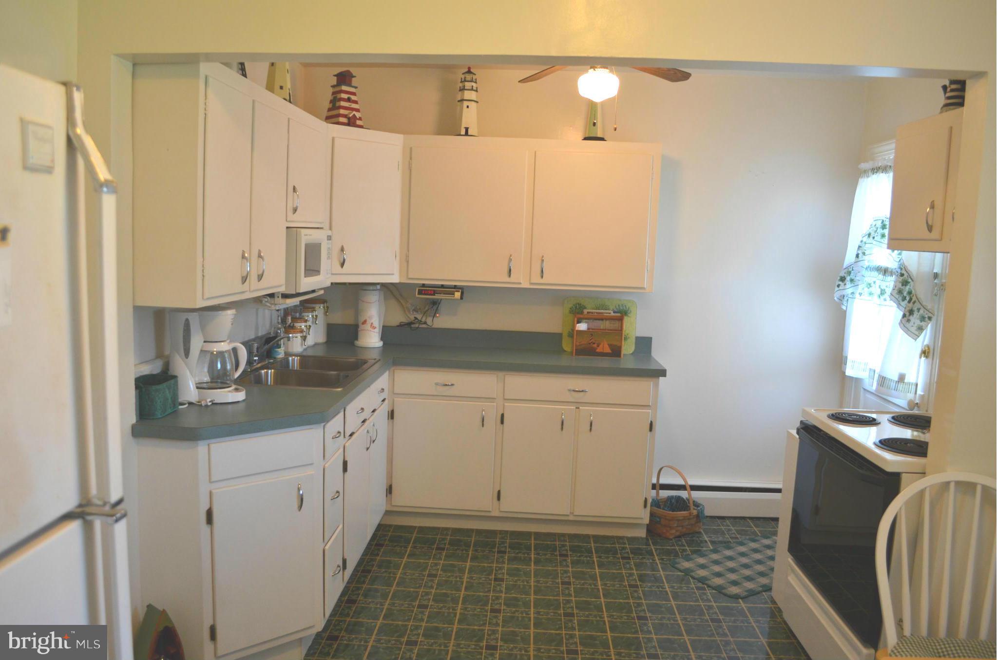38320 Point Breeze Road Coltons Point, MD 20626 - Photo 7 of 13 a bathroom with a granite countertop sink a toilet and a mirror