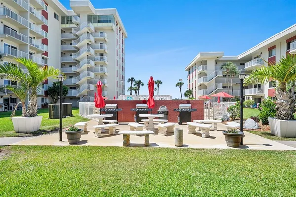 a view of a water fountain and a big yard