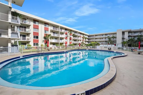 a view of swimming pool with outdoor seating