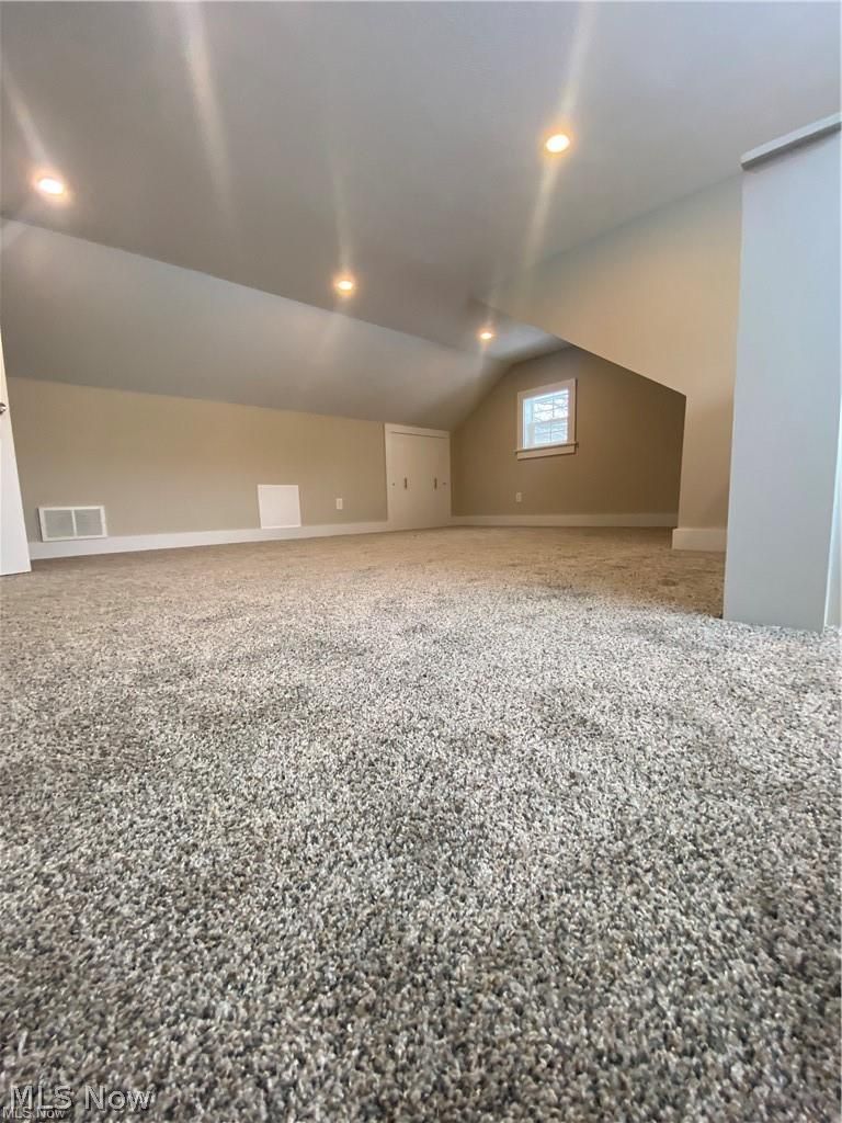 2803 State Road Vermilion, OH 44089 - Photo 17 of 28 Bedroom with brand new carpet, lofted ceiling and recessed lighting.