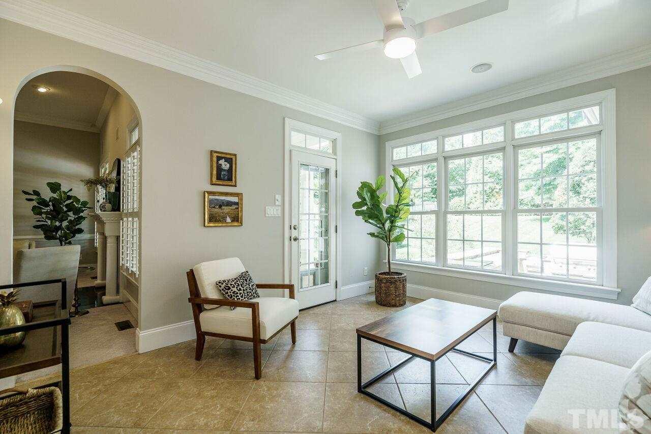 4813 Patton Ridge Court Raleigh, NC 27612 - Photo 14 of 30 a living room with furniture and a large window