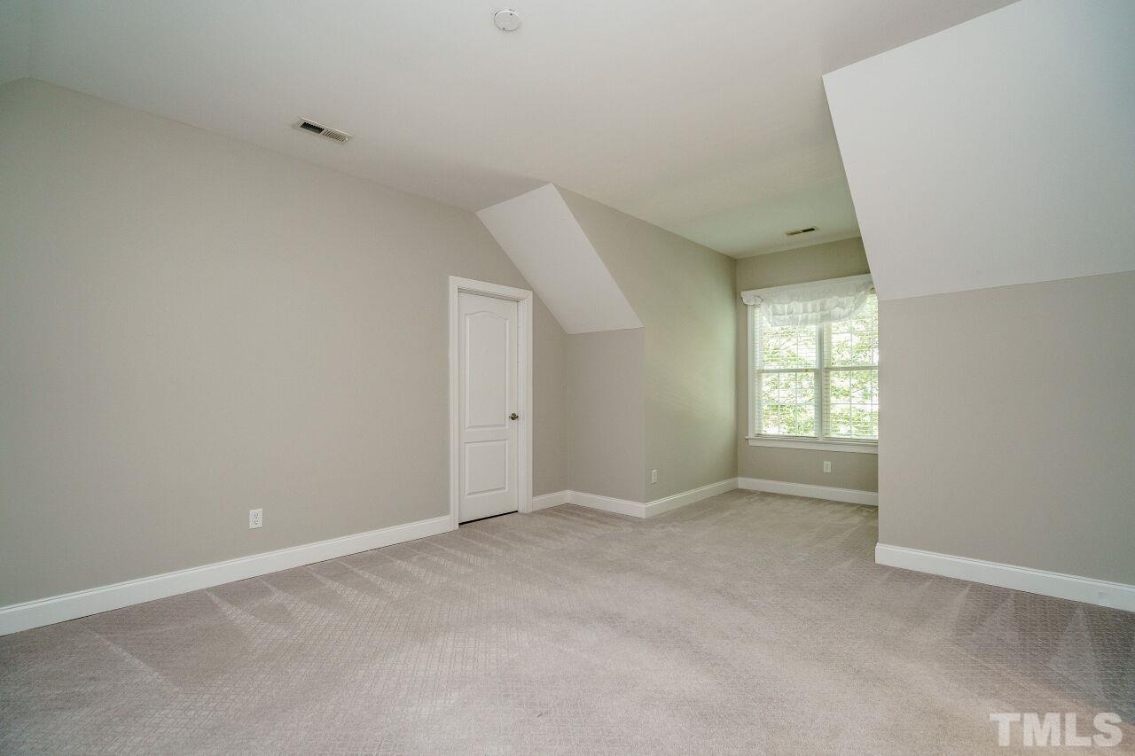 4813 Patton Ridge Court Raleigh, NC 27612 - Photo 21 of 30 an empty room with windows