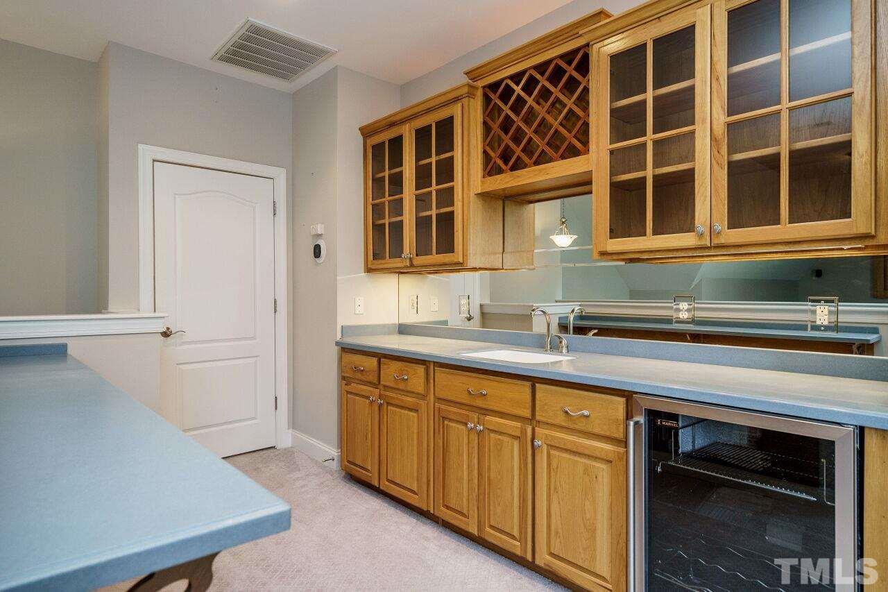 4813 Patton Ridge Court Raleigh, NC 27612 - Photo 24 of 30 a kitchen with a sink and a window