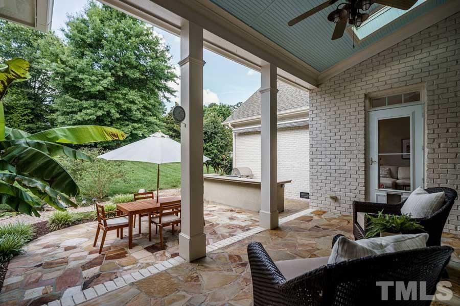 4813 Patton Ridge Court Raleigh, NC 27612 - Photo 26 of 30 a view of a patio with a table chairs and backyard