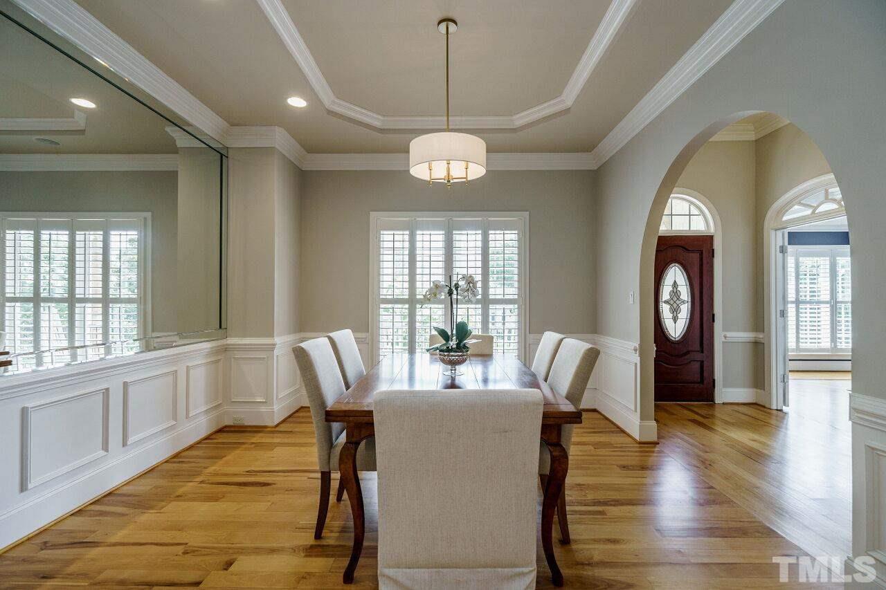 4813 Patton Ridge Court Raleigh, NC 27612 - Photo 5 of 30 a view of a dining room with furniture wooden floor and a chandelier