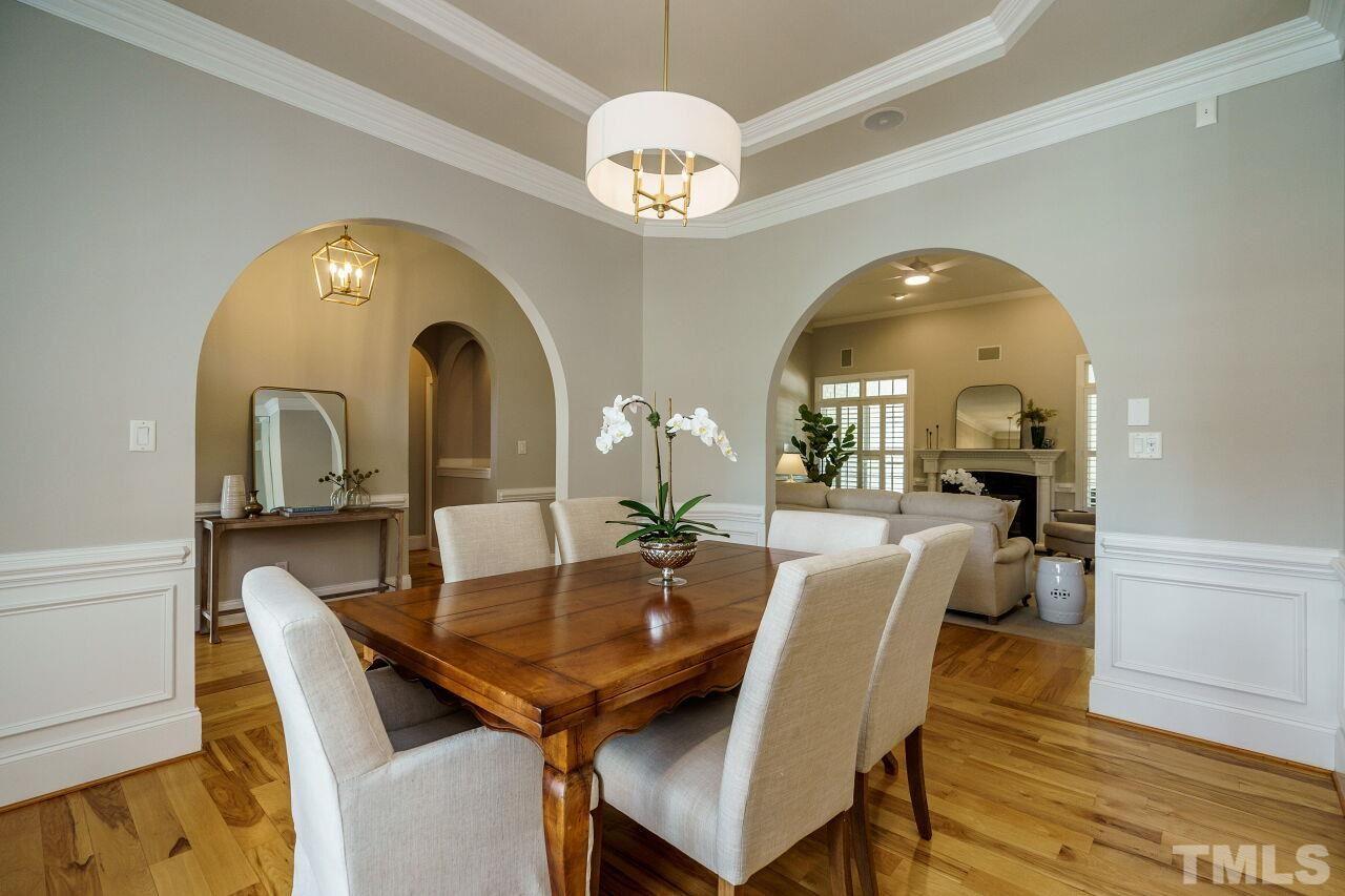4813 Patton Ridge Court Raleigh, NC 27612 - Photo 6 of 30 a view of a dining room with furniture and chandelier