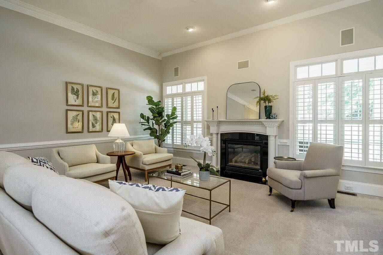 4813 Patton Ridge Court Raleigh, NC 27612 - Photo 9 of 30 a living room with furniture and a fireplace