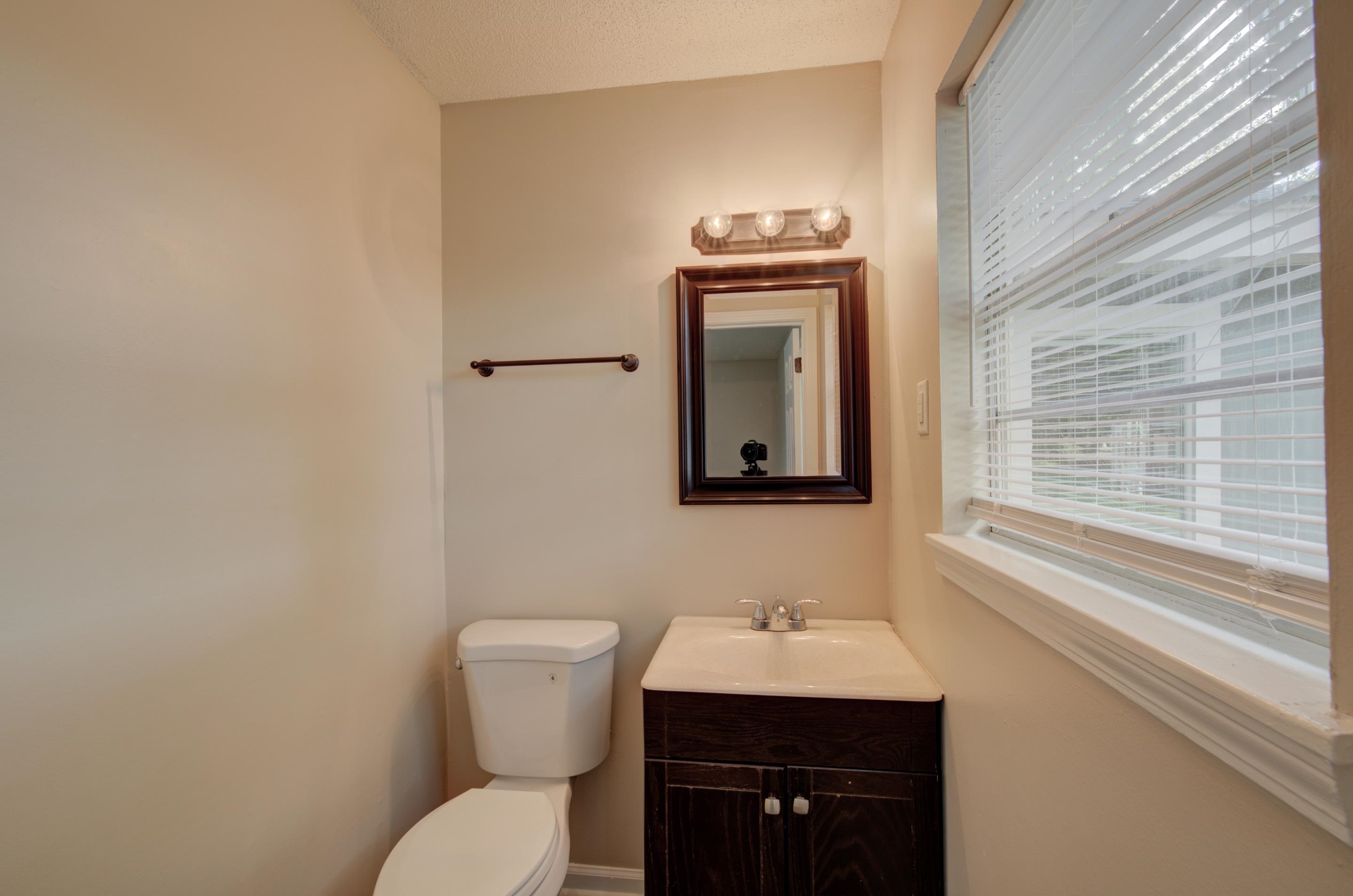 5193 Fairley Road Memphis, TN 38109 - Photo 8 of 17 a bathroom with a toilet sink and mirror