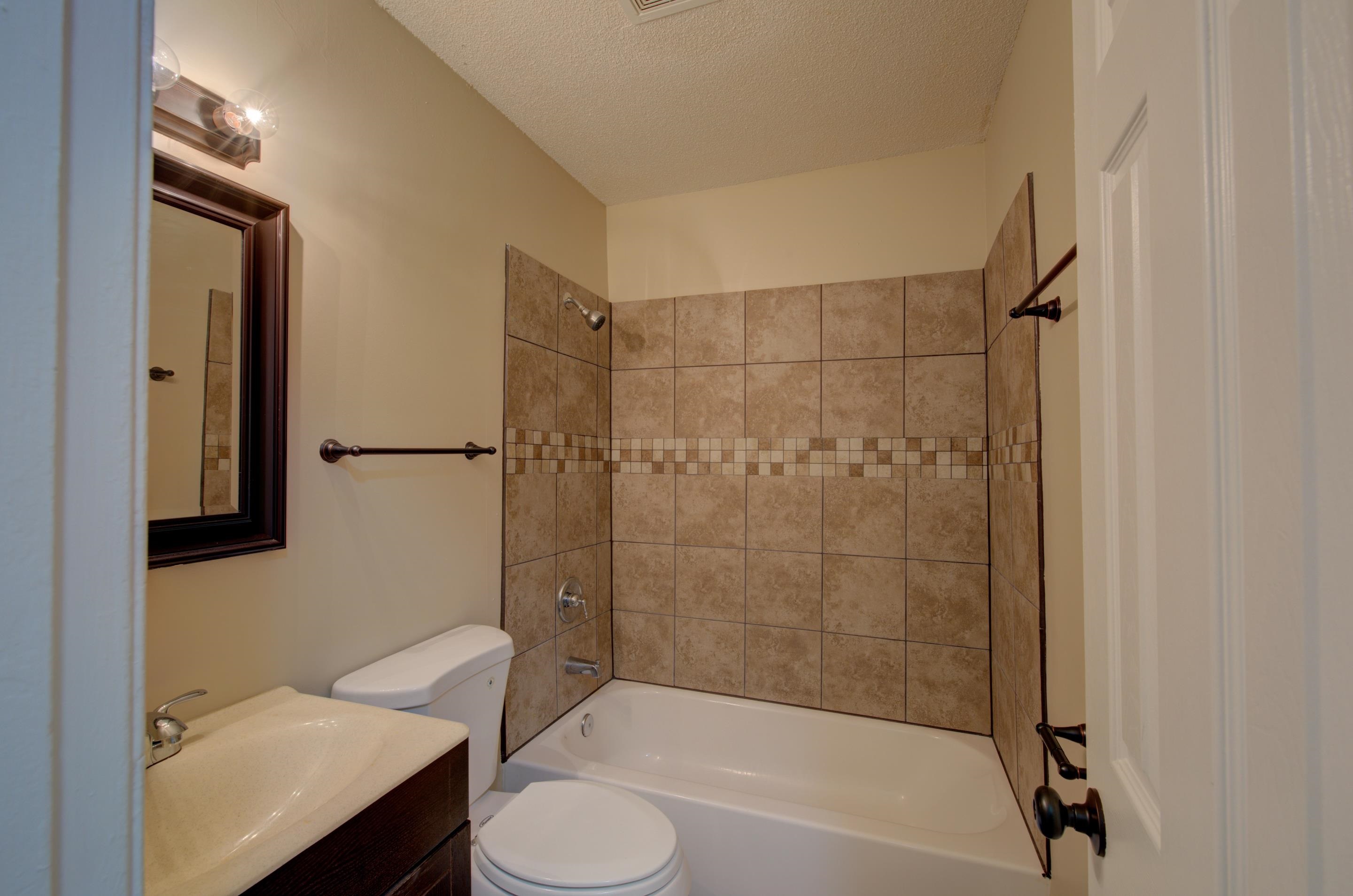 5193 Fairley Road Memphis, TN 38109 - Photo 10 of 17 a bathroom with a sink toilet and shower