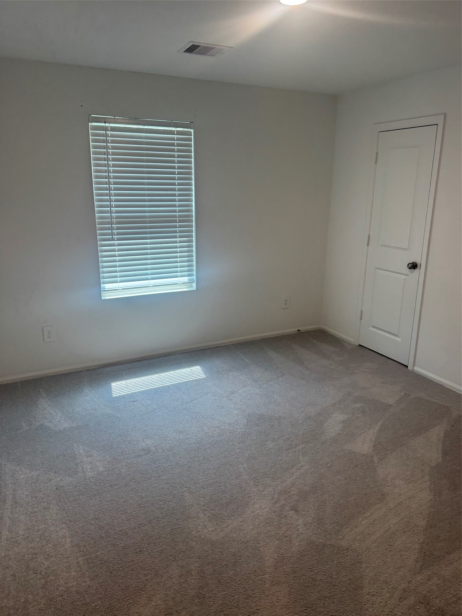 3202 Holly Stokes Way Conroe, TX 77301 - Photo 21 of 24 a view of empty room with window