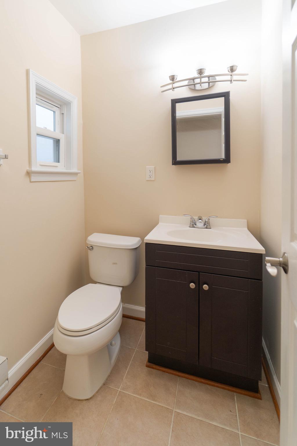 444 Rhode Island Avenue Northwest, Unit 302 Washington, DC 20001 - Photo 13 of 13 a bathroom with a sink toilet and mirror