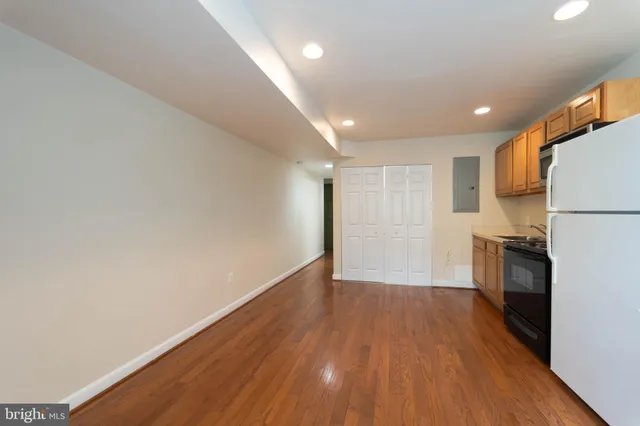 a view of a kitchen with a sink and a stove top oven