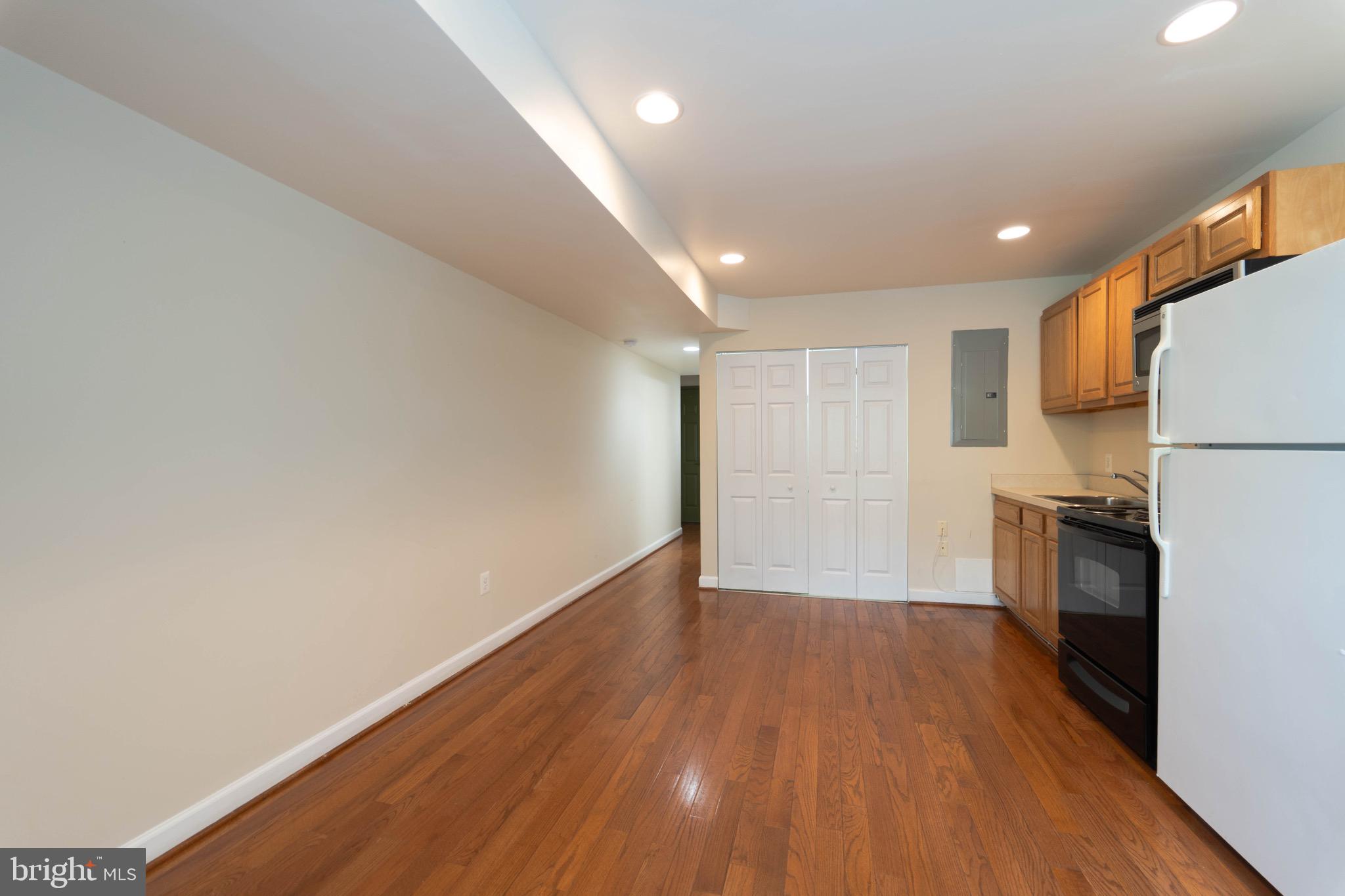 444 Rhode Island Avenue Northwest, Unit 302 Washington, DC 20001 - Photo 4 of 13 a view of a kitchen with a sink and a stove top oven