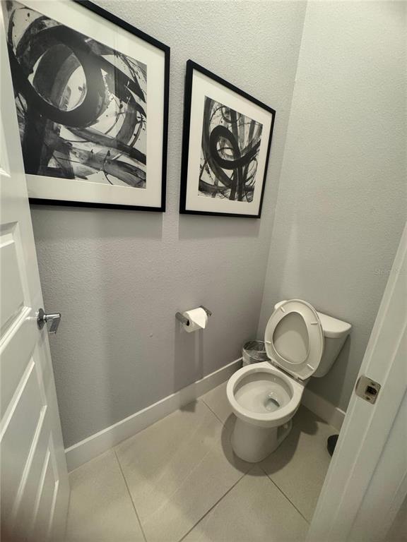 7770 Sandy Ridge Drive, Unit 210 Reunion, FL 34747 - Photo 17 of 42 a bathroom with a toilet and a sink