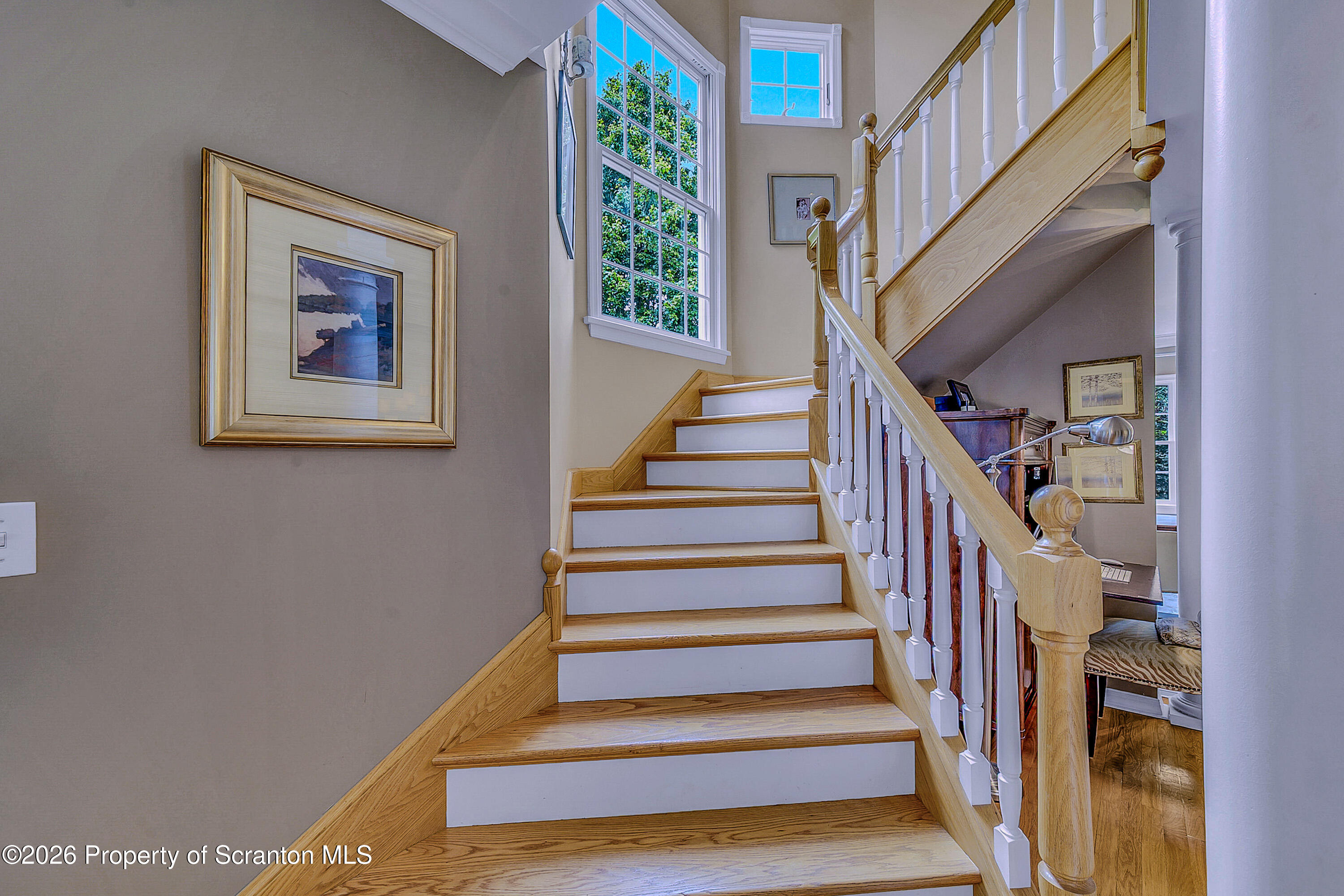 330 Glenburn Road Clarks Green, PA 18411 - Photo 21 of 69 a view of staircase with lots of frames on wall and a window