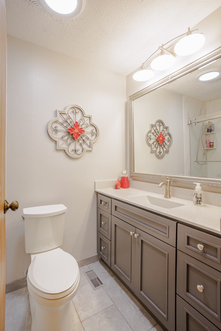 540 Basil Street Springboro, OH 45066 - Photo 21 of 32 This bright bathroom features a spacious vanity with ample storage and a sleek, contemporary design.