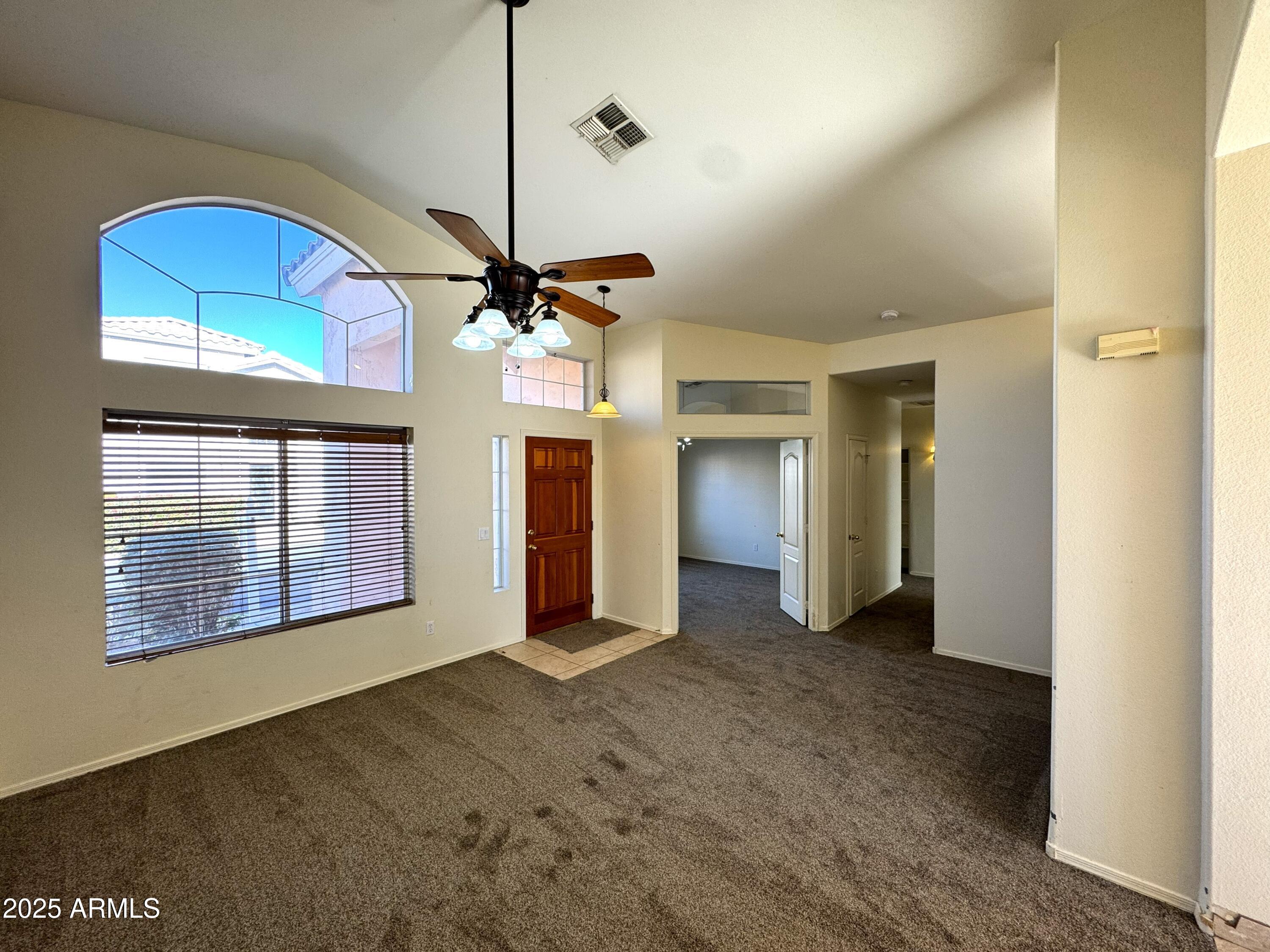 4906 East Brown Road, Unit 38 Mesa, AZ 85205 - Photo 5 of 14 a view of an empty room with a window