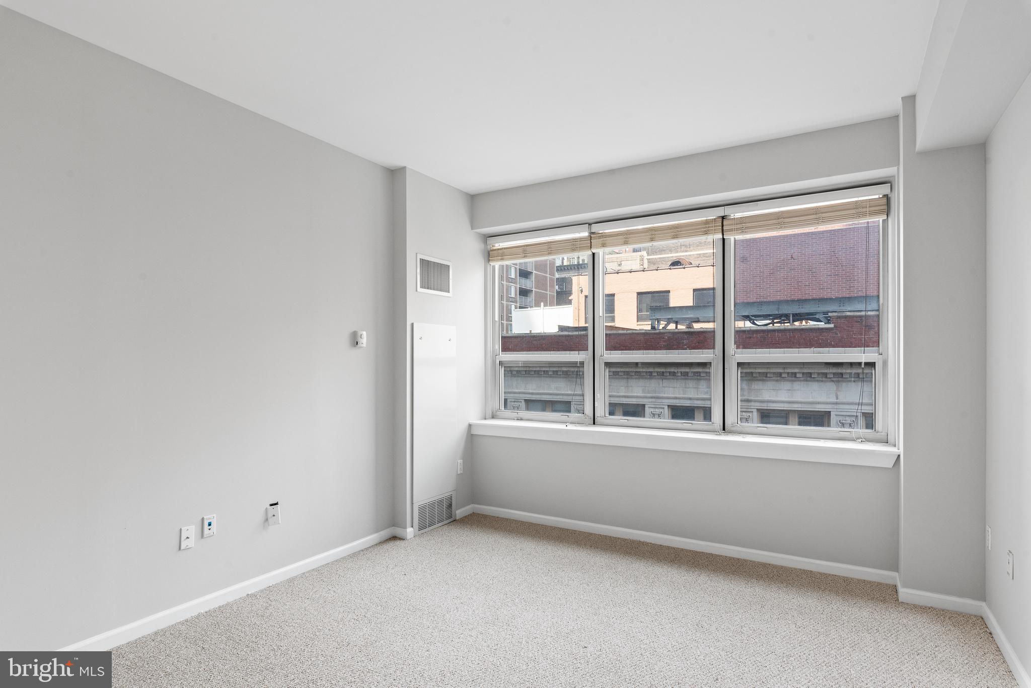 1425 Locust Street, Unit 9E Philadelphia, PA 19102 - Photo 11 of 15 a view of an empty room with a window