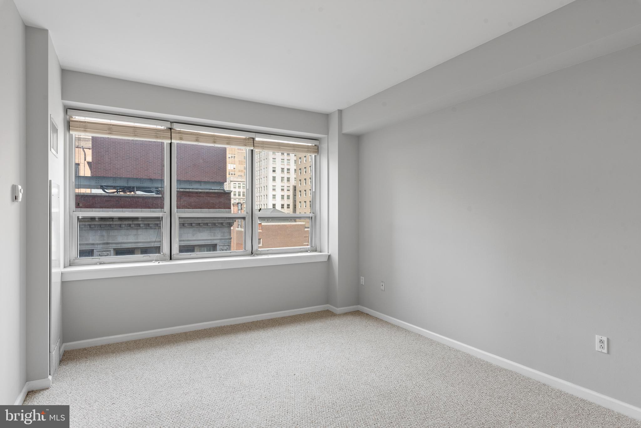1425 Locust Street, Unit 9E Philadelphia, PA 19102 - Photo 10 of 15 an empty room with a window