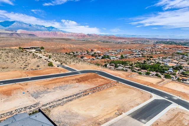 Undisclosed Address St. George, UT 84770 - Photo 2 of 10 New construction lots featuring paved roads, graded land, and partial rock retaining walls