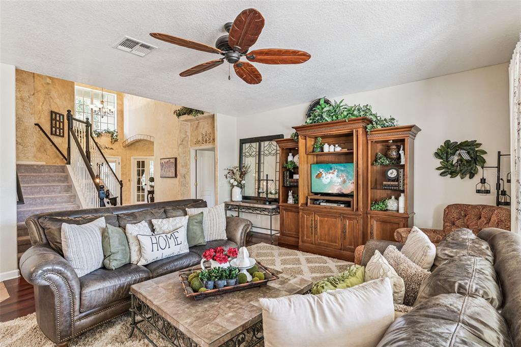 3304 Beazer Drive Ocoee, FL 34761 - Photo 12 of 53 a living room with furniture and a flat screen tv