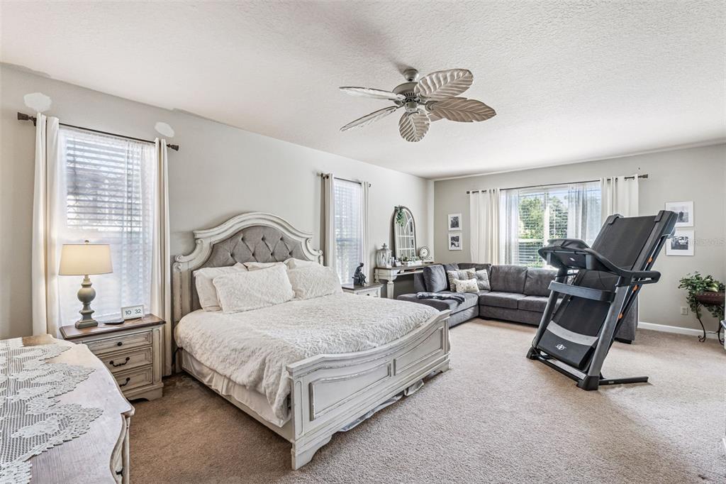 3304 Beazer Drive Ocoee, FL 34761 - Photo 20 of 53 a bedroom with a bed a chair and couch