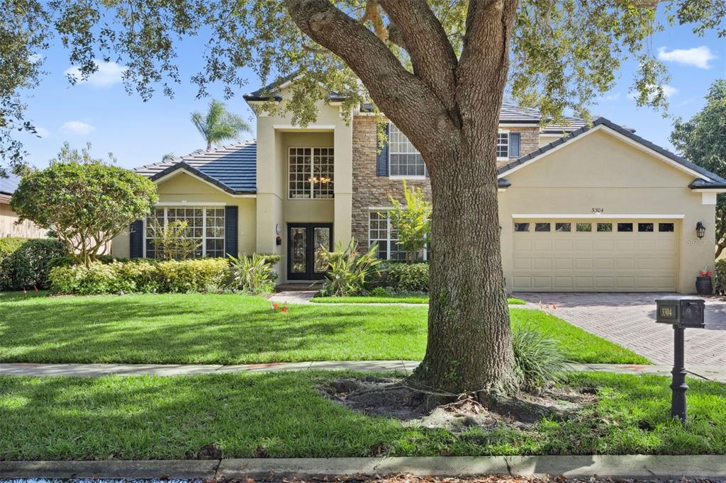 3304 Beazer Drive Ocoee, FL 34761 - Photo 2 of 53 a front view of a house with a yard
