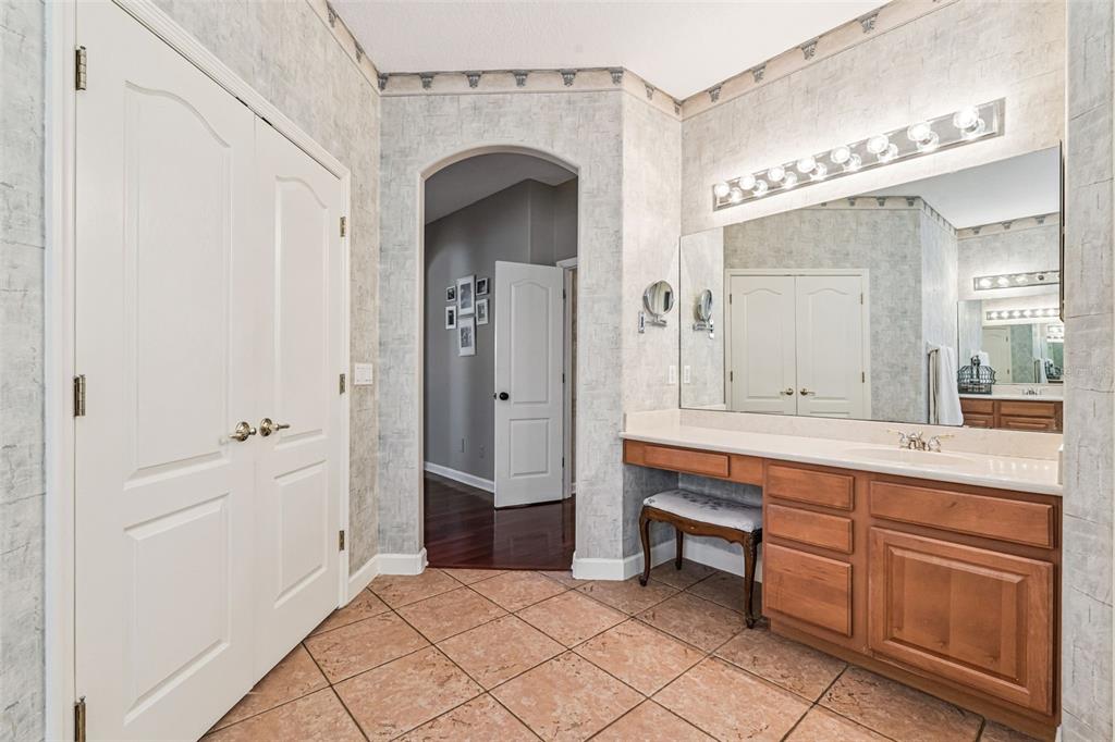 3304 Beazer Drive Ocoee, FL 34761 - Photo 23 of 53 a spacious bathroom with a double vanity sink a mirror and a bathtub