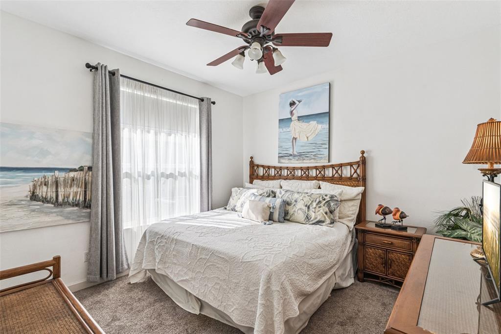 3304 Beazer Drive Ocoee, FL 34761 - Photo 24 of 53 a bedroom with a bed and a chandelier