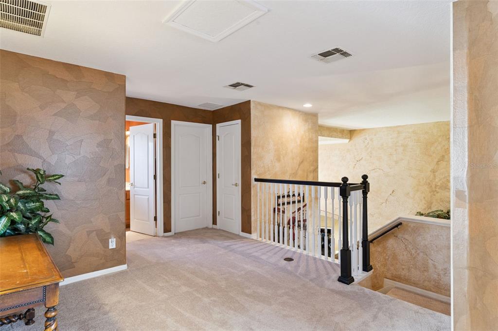 3304 Beazer Drive Ocoee, FL 34761 - Photo 28 of 53 a view of a hallway with a potted plant in a room