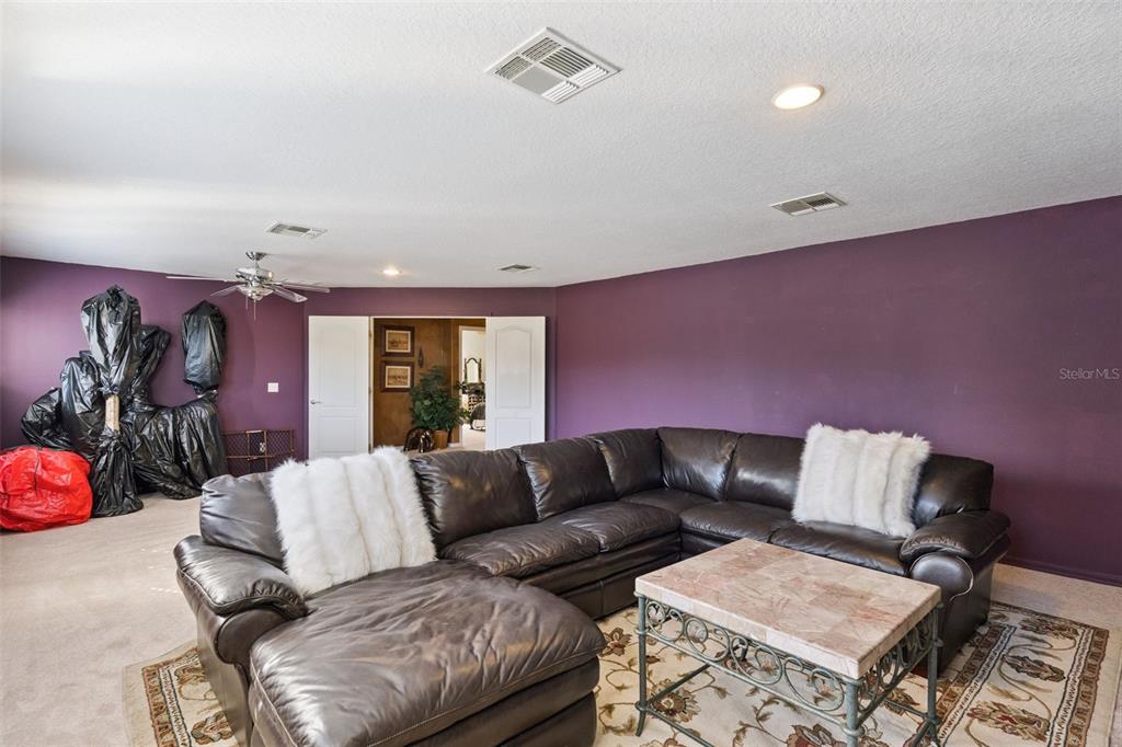 3304 Beazer Drive Ocoee, FL 34761 - Photo 32 of 53 a living room with furniture and a window