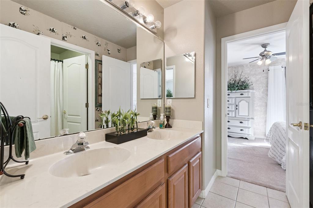 3304 Beazer Drive Ocoee, FL 34761 - Photo 35 of 53 a bathroom with a tub sink and mirror