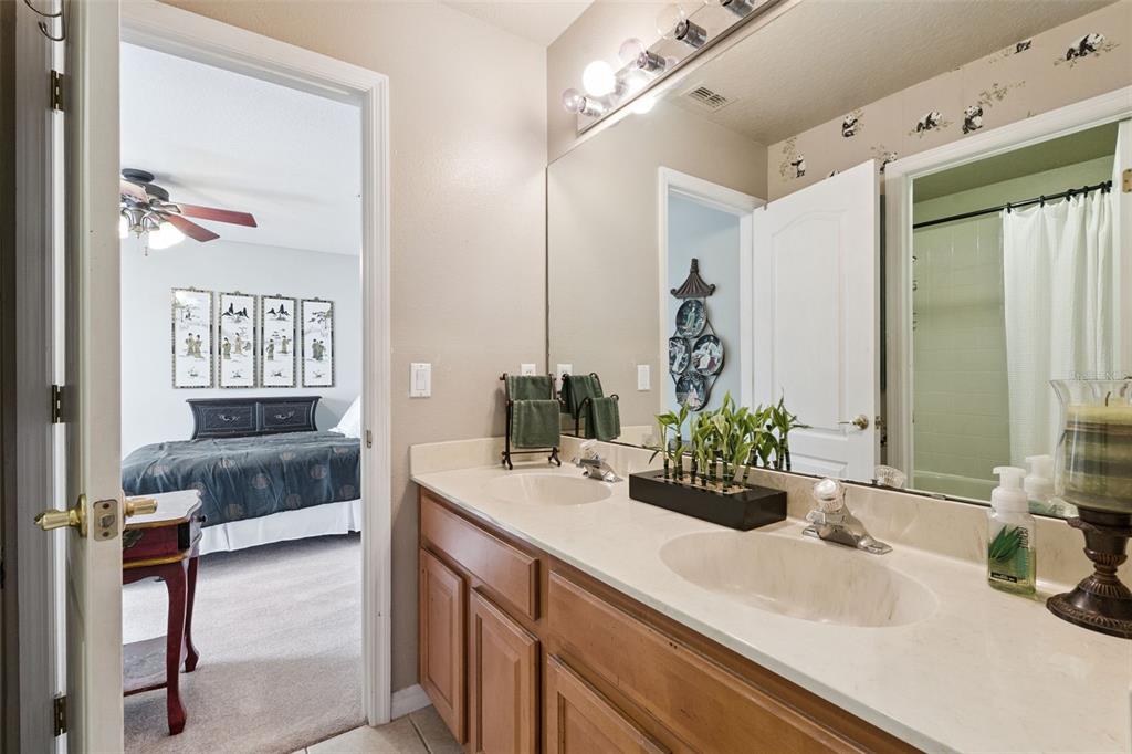 3304 Beazer Drive Ocoee, FL 34761 - Photo 36 of 53 a bathroom with a sink and a mirror