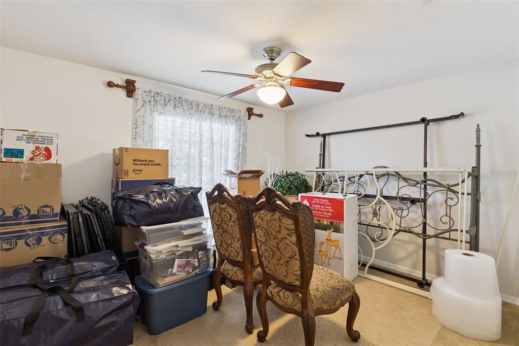 3304 Beazer Drive Ocoee, FL 34761 - Photo 38 of 53 a living room with furniture a air conditioner and a window