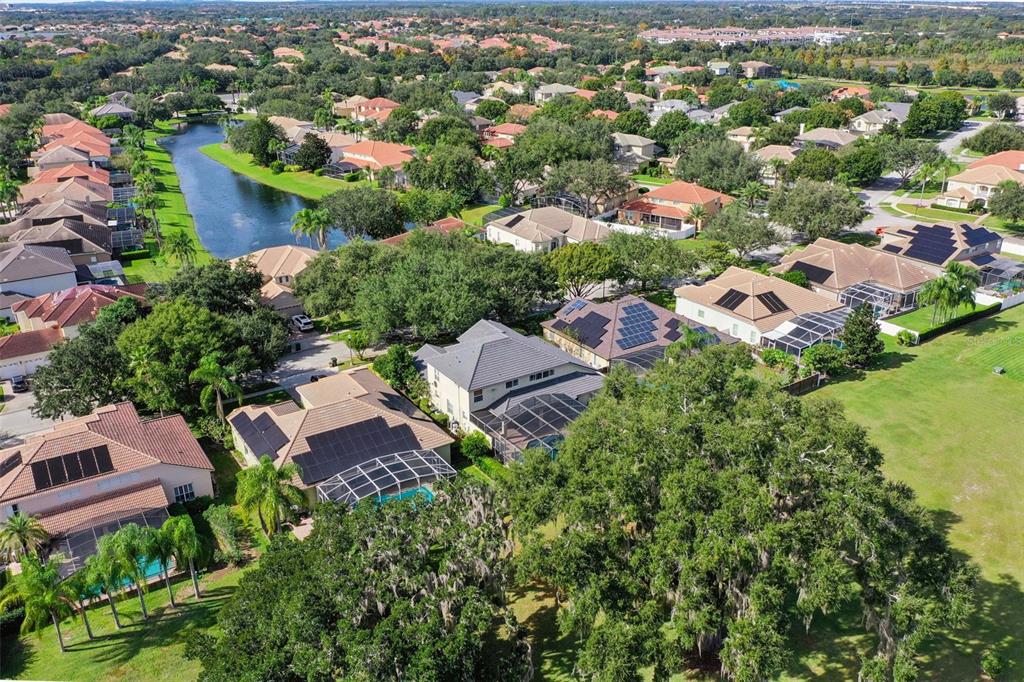 3304 Beazer Drive Ocoee, FL 34761 - Photo 50 of 53 an aerial view of residential houses with outdoor space and trees