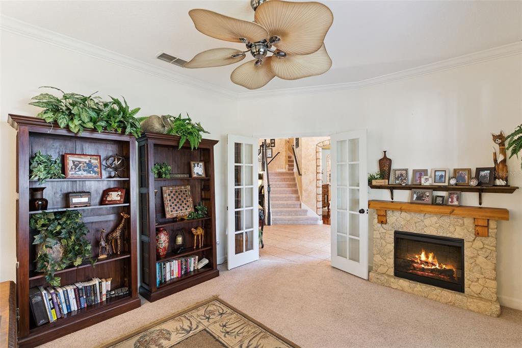 3304 Beazer Drive Ocoee, FL 34761 - Photo 8 of 53 a living room with furniture and a fireplace