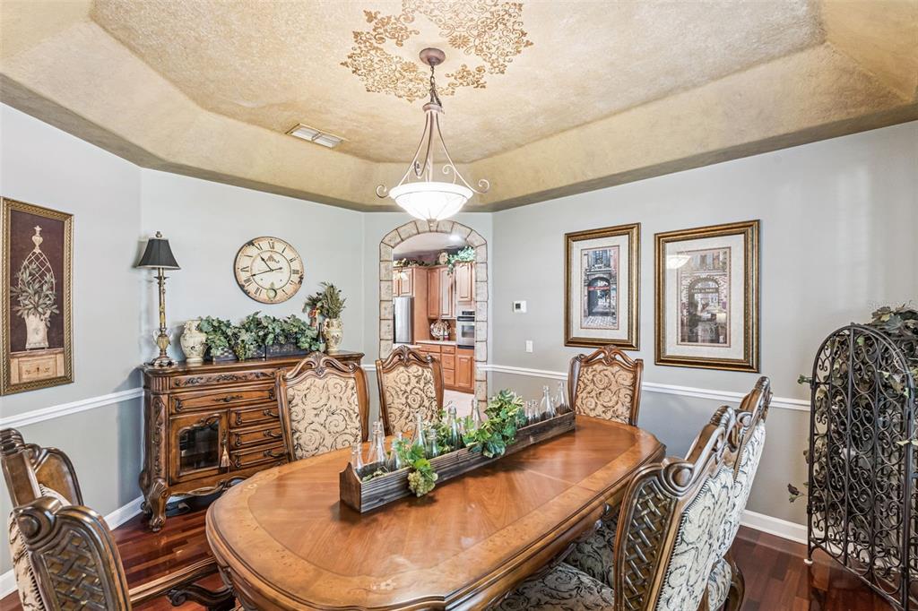 3304 Beazer Drive Ocoee, FL 34761 - Photo 10 of 53 a dining room with furniture a window and wooden floor