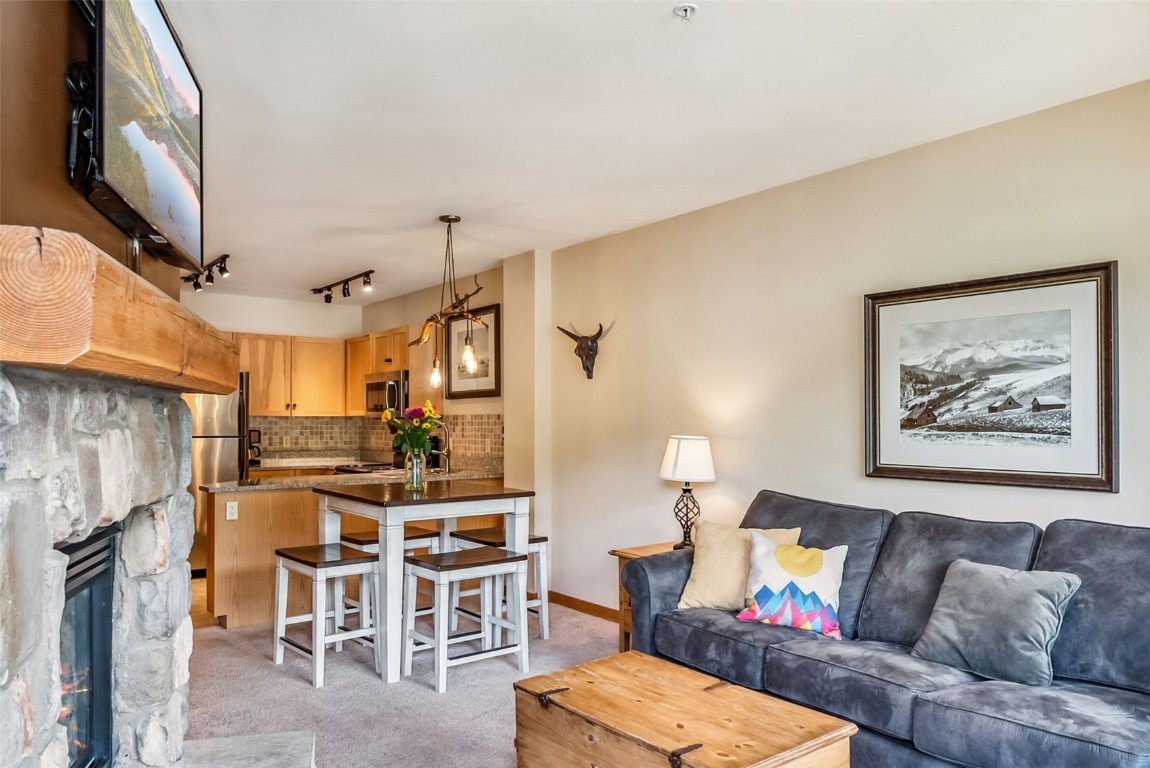 100 Dercum Square, Unit 8386 Keystone, CO 80435 - Photo 13 of 34 a living room with furniture and a fireplace