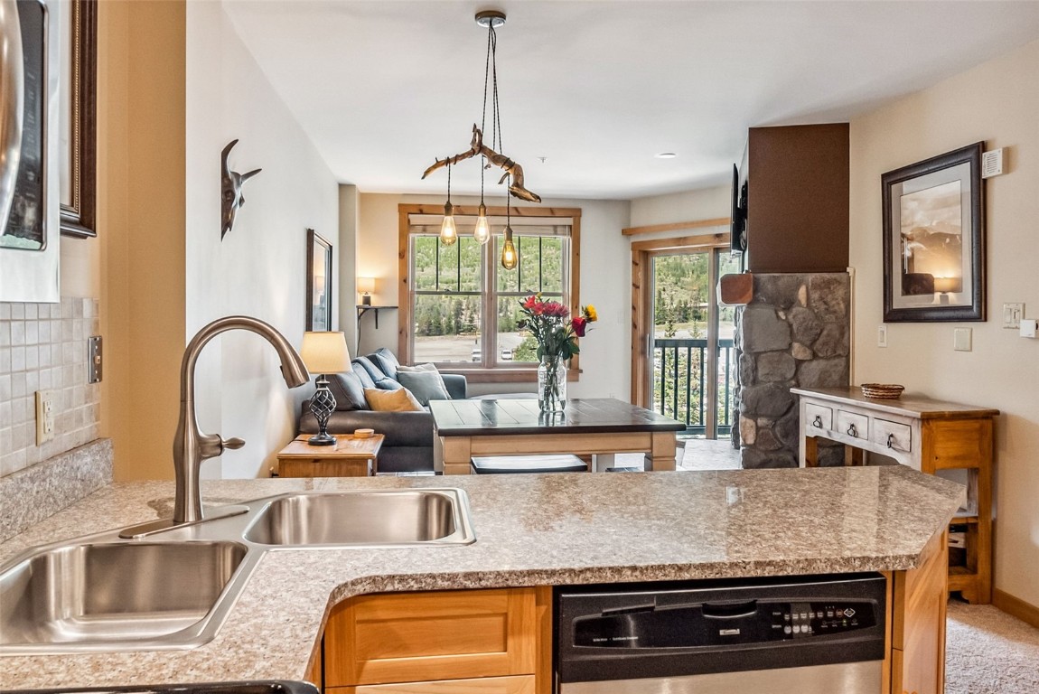 100 Dercum Square, Unit 8386 Keystone, CO 80435 - Photo 18 of 34 a kitchen with stainless steel appliances granite countertop a sink and a granite counter tops