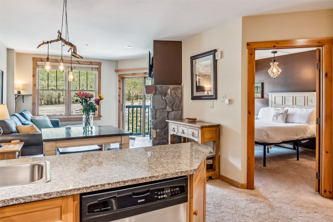 100 Dercum Square, Unit 8386 Keystone, CO 80435 - Photo 2 of 34 a kitchen with sink and chairs