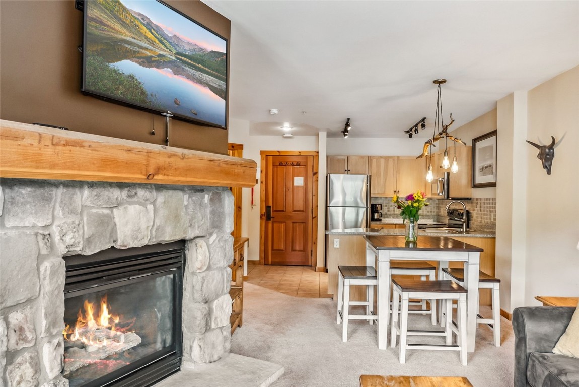 100 Dercum Square, Unit 8386 Keystone, CO 80435 - Photo 32 of 34 a kitchen with furniture and a fireplace
