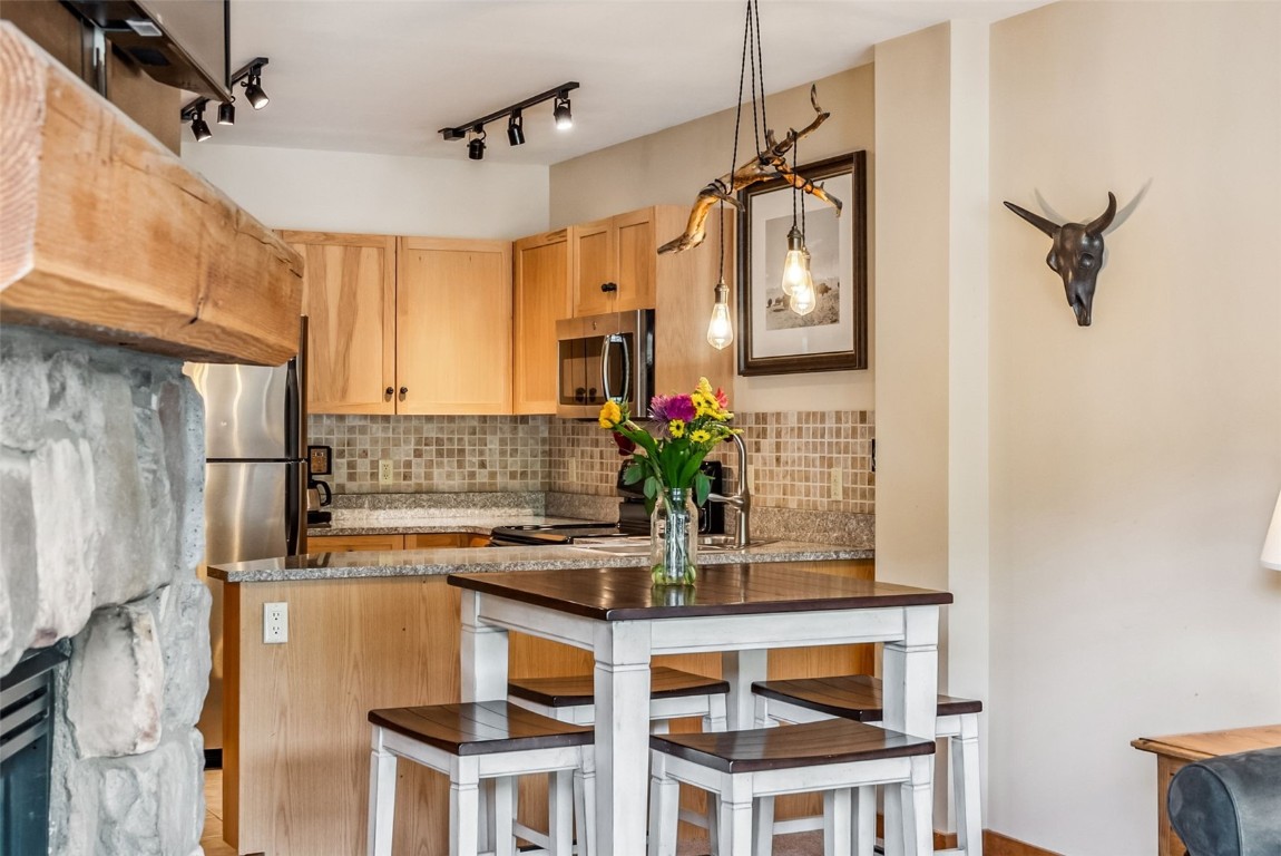 100 Dercum Square, Unit 8386 Keystone, CO 80435 - Photo 6 of 34 a kitchen with a refrigerator and countertop