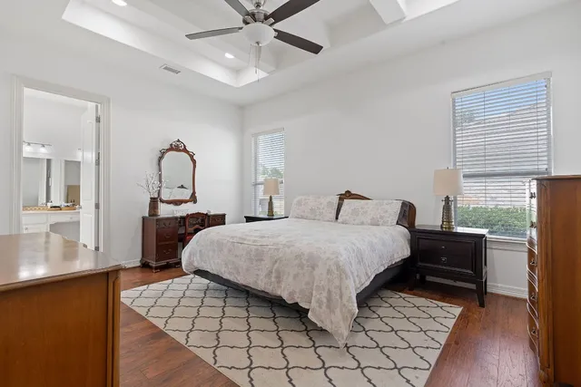 a bed room with a bed and a chandelier