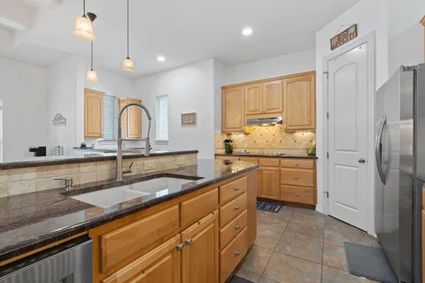 $599,990 | 18 Tourney Lane, The Hills, TX 78738