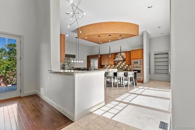 a kitchen with a table and chairs