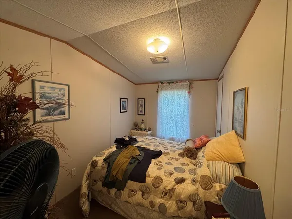 a bathroom with a toilet and a shower curtain
